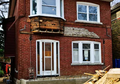 A house with a foundation issue is seen. Basement Systems Waterproofing & Foundation is a foundation contractor.