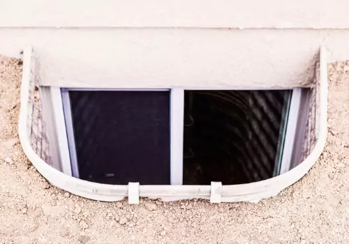 An egress window is seen. Basement Systems Waterproofing & Foundation install Egress Windows in Peoria IL.